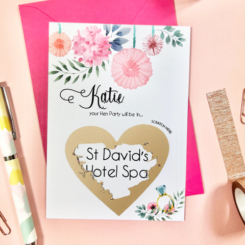 Cute scratch off card with watercolour flowers and engagement ring illustration to reveal a surprise trip abroad for the hen party