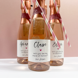 Mini champagne or prosecco labels for bridesmaid proposal box. Simple calligraphy writing with a coloured heart, personalised with names and roles. 
